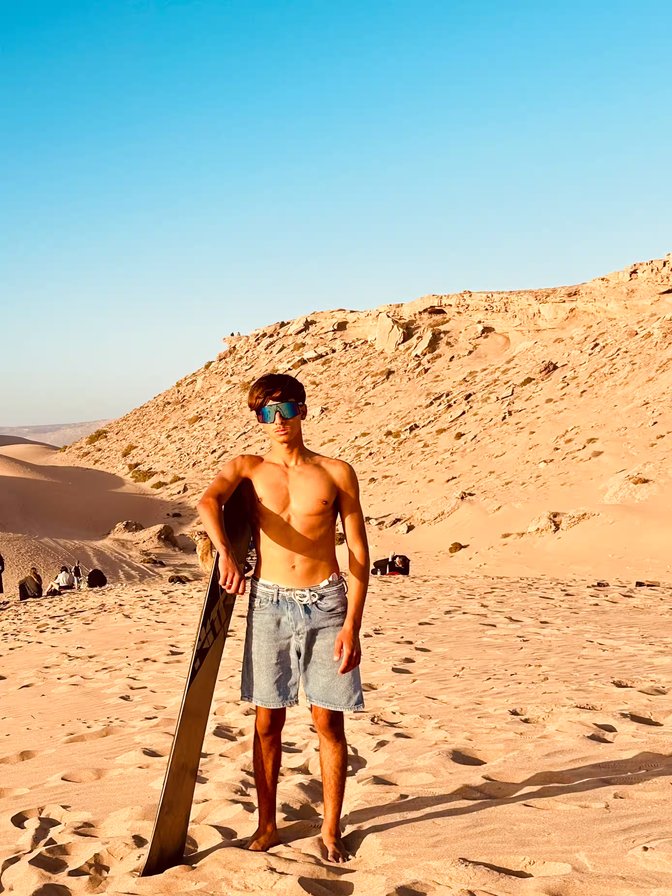 Coastal view with surfer